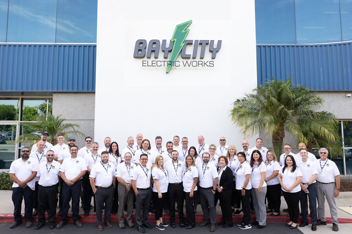 Bay City Industrial team members standing outside company headquarters.