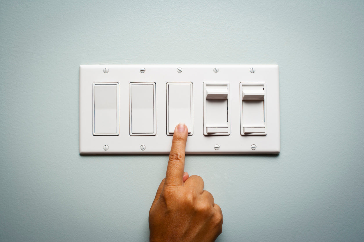 Finger turns on light, sure of power because of generator reliability. 